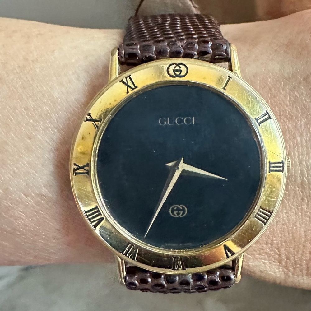 Gucci Gold and Black Luxury Watch